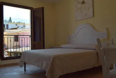 Letto o letti in una camera di casa AGORA By La Via Del Mare Viaggi e Vacanze