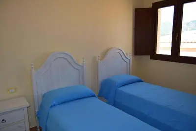Letto o letti in una camera di casa AGORA By La Via Del Mare Viaggi e Vacanze