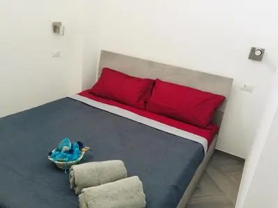 Letto o letti in una camera di Il Quarzo A) B)