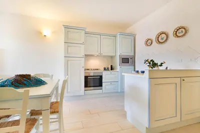 Cucina o angolo cottura di Pavoncelle - Appartamento a Villasimius con giardino privato a pochi passi dal mare