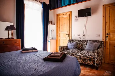 Letto o letti in una camera di Bobo's House Calasetta
