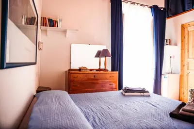 Letto o letti in una camera di Bobo's House Calasetta