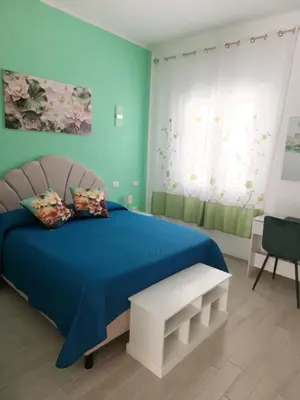 Letto o letti in una camera di Affittacamere LE RONDINI
