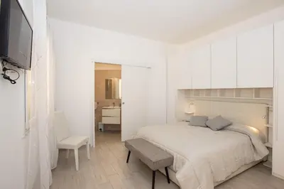 Letto o letti in una camera di Affittacamere LE RONDINI