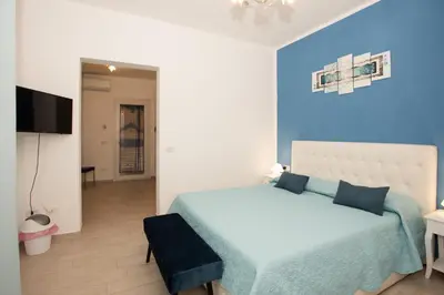 Letto o letti in una camera di Affittacamere LE RONDINI