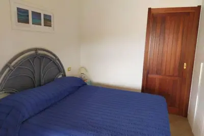 Letto o letti in una camera di Villa ALBERTA - Villasimius, spiaggia di Campus