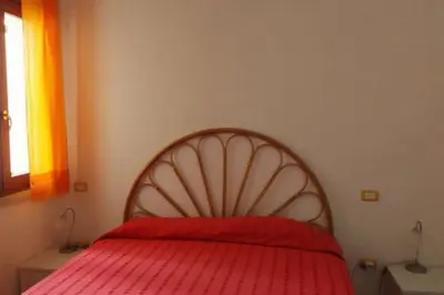 Letto o letti in una camera di Villa ALBERTA - Villasimius, spiaggia di Campus