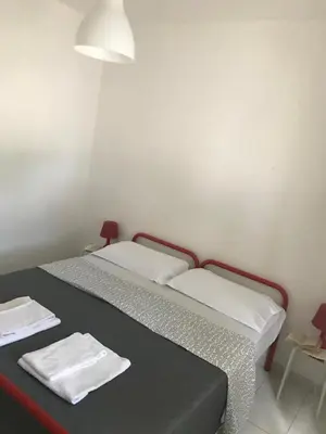Letto o letti in una camera di Appartamenti Le Mimose