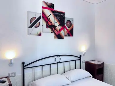 Letto o letti in una camera di Villa Julien Quartu Sant'Elena Sardegna