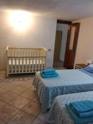 Letto o letti in una camera di Casa Deidda