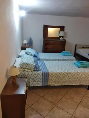 Letto o letti in una camera di Casa Deidda