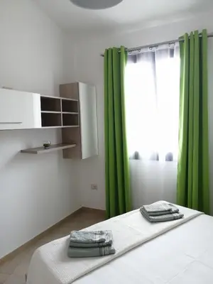 Letto o letti in una camera di Appartamento Monte Granatico 02