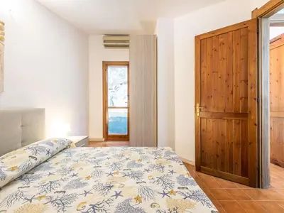 Letto o letti in una camera di VILLA CLAUDIO e LUNETTA