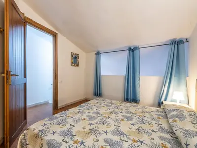 Letto o letti in una camera di VILLA CLAUDIO e LUNETTA