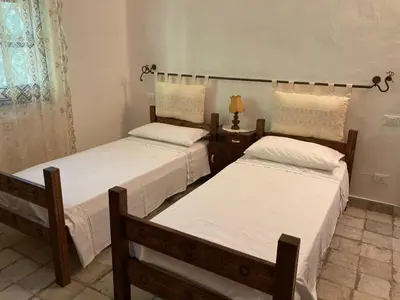 Letto o letti in una camera di Villa Serena