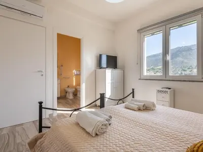 Letto o letti in una camera di Villa Chiara Solanas