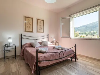 Letto o letti in una camera di Villa Chiara Solanas