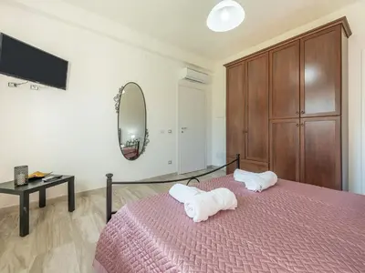 Letto o letti in una camera di Villa Chiara Solanas