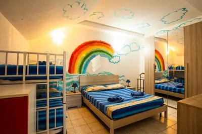 Letto o letti in una camera di Arcobaleno 2