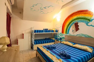 Letto o letti in una camera di Arcobaleno 2
