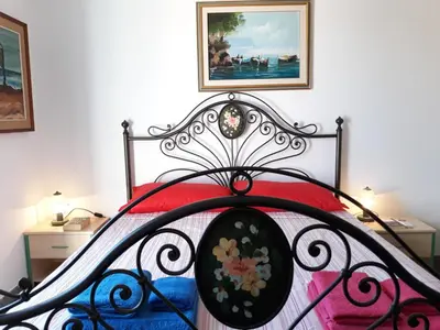 Letto o letti in una camera di L' Attico