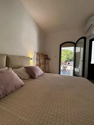 Letto o letti in una camera di Villa La Caletta