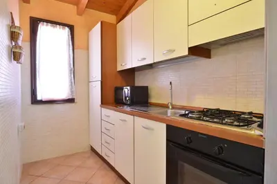 Cucina o angolo cottura di IzzHome Nora Beach