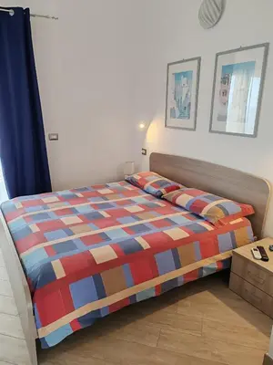 Letto o letti in una camera di Villa Orsola