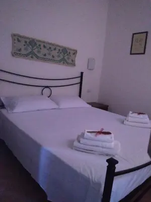 Letto o letti in una camera di Villetta Sa Speciosa