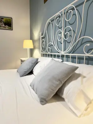 Letto o letti in una camera di Villa SALMAGI - Sardegna