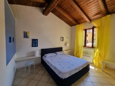 Letto o letti in una camera di VILLA TRAMONTI SUL MARE