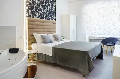 Letto o letti in una camera di Atena Rooms
