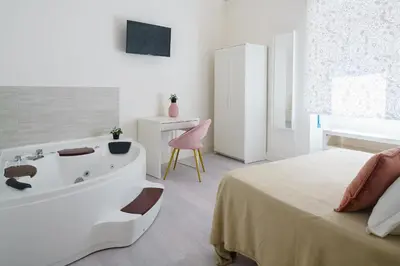 Letto o letti in una camera di Atena Rooms