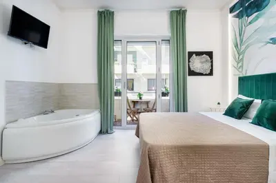 Letto o letti in una camera di Atena Rooms