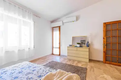 Letto o letti in una camera di Casa Cala Biriala