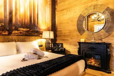 Letto o letti in una camera di BAITA MAORE luxury rooms & Spa