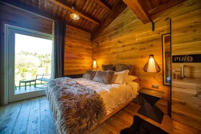 Letto o letti in una camera di BAITA MAORE luxury rooms & Spa