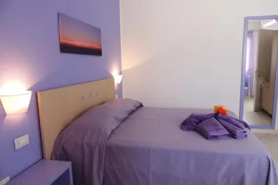 Letto o letti in una camera di Hotel Arcupintau formula B&B