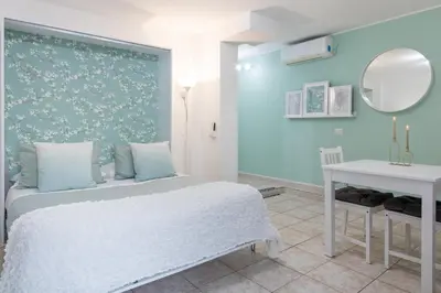 Letto o letti in una camera di Tiny House in Cagliari