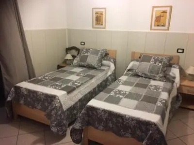 Letto o letti in una camera di Villa de la TORRE DI BARI SARDO