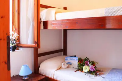 Letto o letti in una camera di Apartment Costa Rei near Sandy Beaches