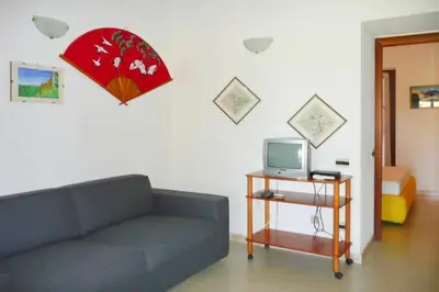TV o dispositivi per l'intrattenimento presso Terraced House by Sardinia's White Beaches