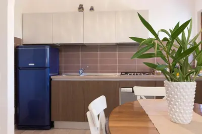Cucina o angolo cottura di Casa Azzurra - Casa con giardino privato a Costa Rei a due passi dal mare