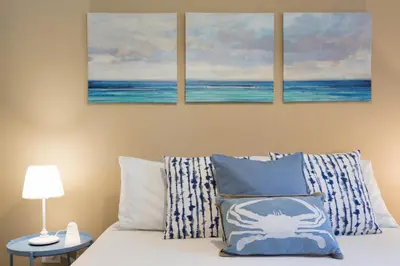 Letto o letti in una camera di Casa Azzurra - Casa con giardino privato a Costa Rei a due passi dal mare