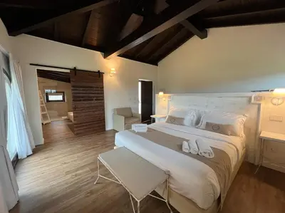 Letto o letti in una camera di Corte Maddalena Camere