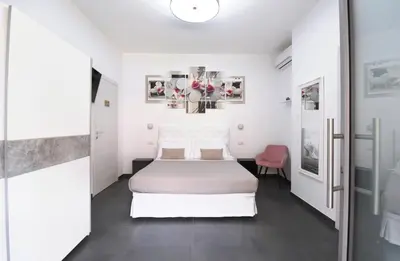 Letto o letti in una camera di Elis b&b Villasimius