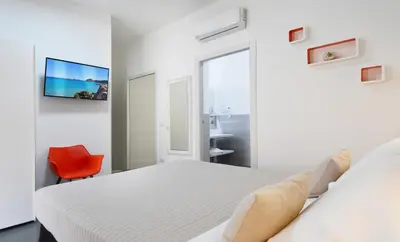 Letto o letti in una camera di Elis b&b Villasimius