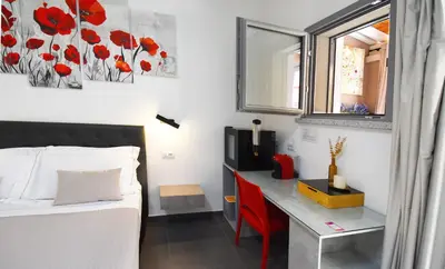 Letto o letti in una camera di Elis b&b Villasimius