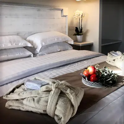 Letto o letti in una camera di Villa Corte Maddalena