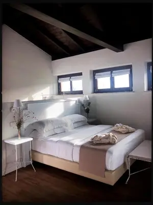 Letto o letti in una camera di Villa Corte Maddalena